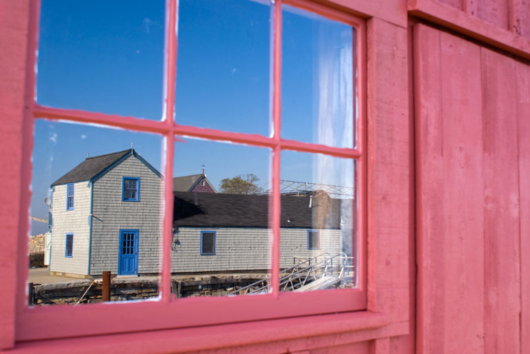 Motif-2_DSC05679.jpg - #0256_Reflection of Motif #2 on the window of Motif #1, Rockport, MA.  The buildings are called Motifs by the artist colony residing on Cape Ann.