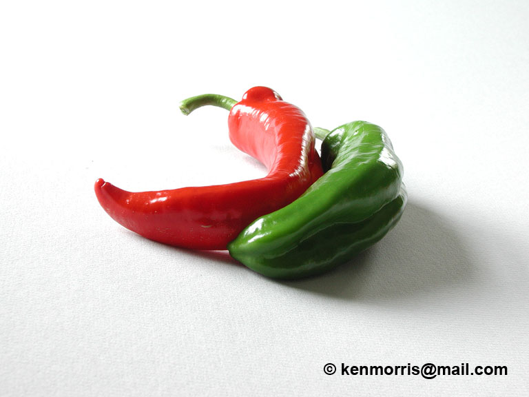 Pepper-3-web.jpg - #0272_Sensuous Peppers:  Peppers from our garden that called out to be photographed together.  A set of four small pictures in a 36 inch frame looks good on the kitchen wall.